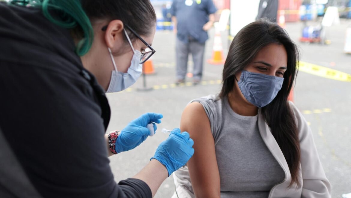 Woman-getting-vaccinated-in-LA-e1617155634393